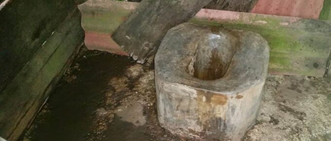 Many outhouses just have a hole in the floor. This toilet is actually constructed out of cement.