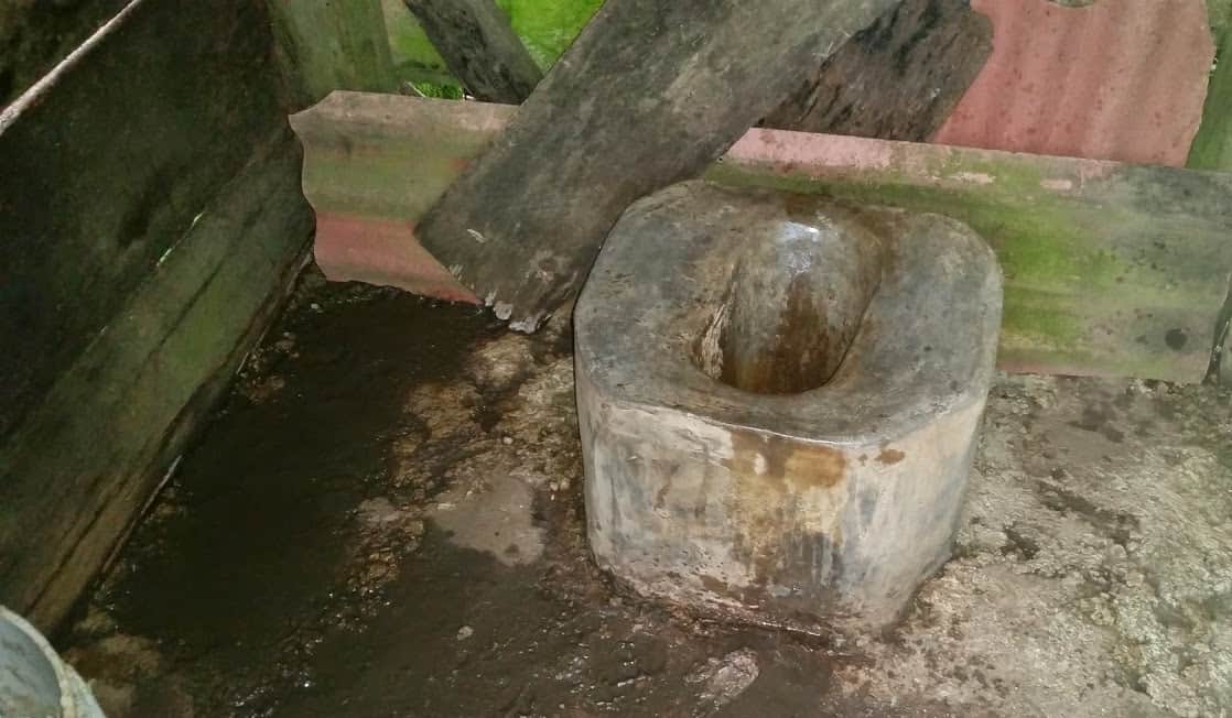 Many outhouses just have a hole in the floor. This toilet is actually constructed out of cement.
