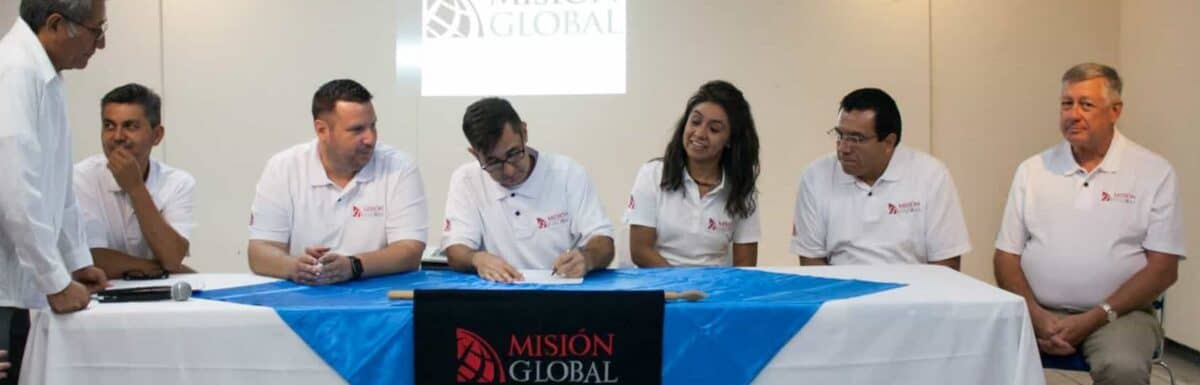 Signing the constitutional act for the non-profit incorporation of Globe Mexico as the notary public witnesses the signatures.