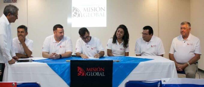 Signing the constitutional act for the non-profit incorporation of Globe Mexico as the notary public witnesses the signatures.